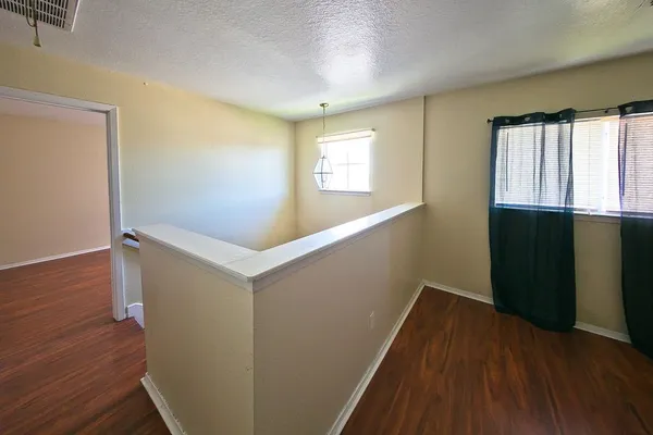 a view of entryway with wooden floor
