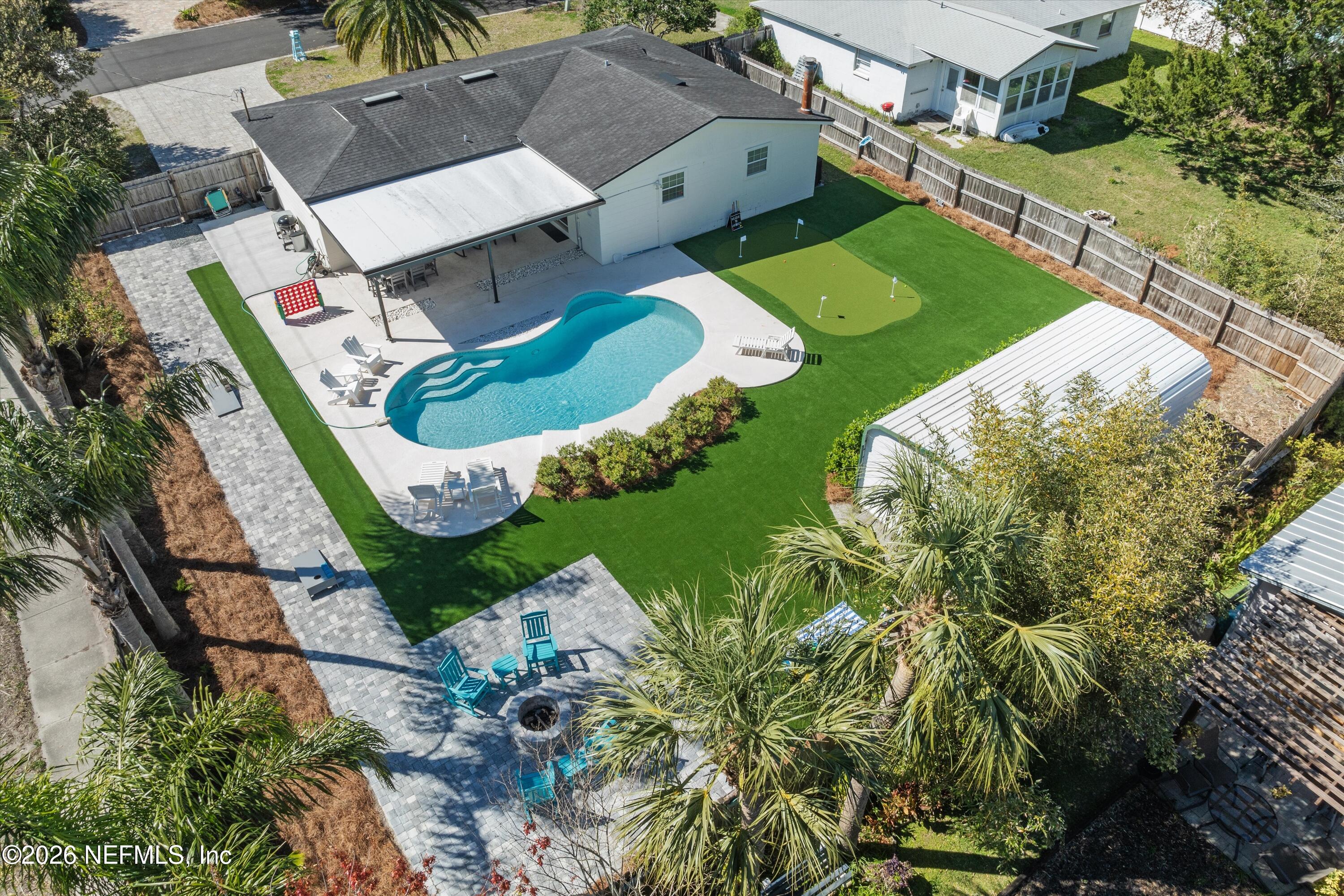 an aerial view of a house with outdoor space