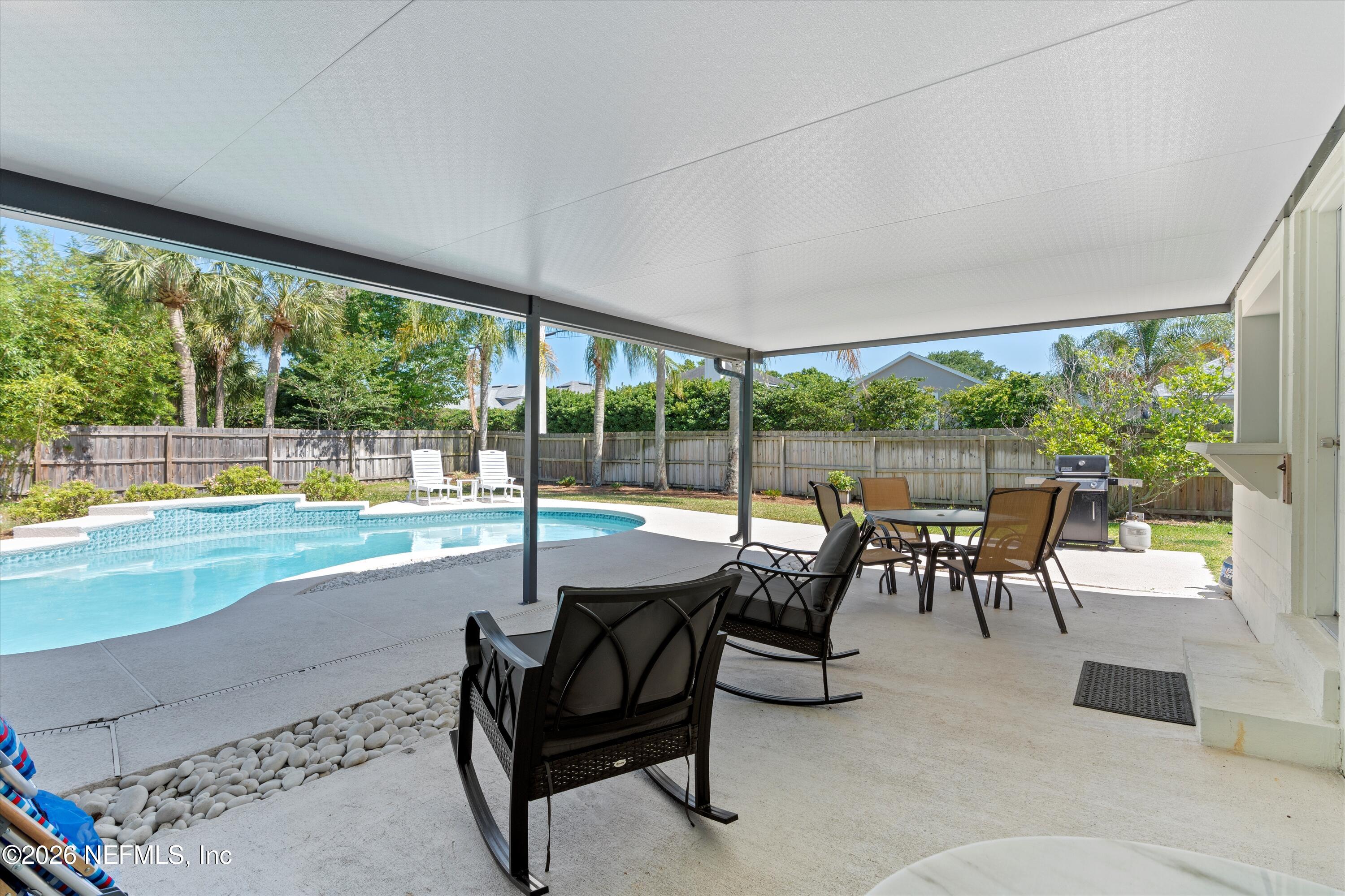 31 Norberta Way Jacksonville Beach, FL 32250 - Photo 12 of 49 a living room with furniture and a floor to ceiling window