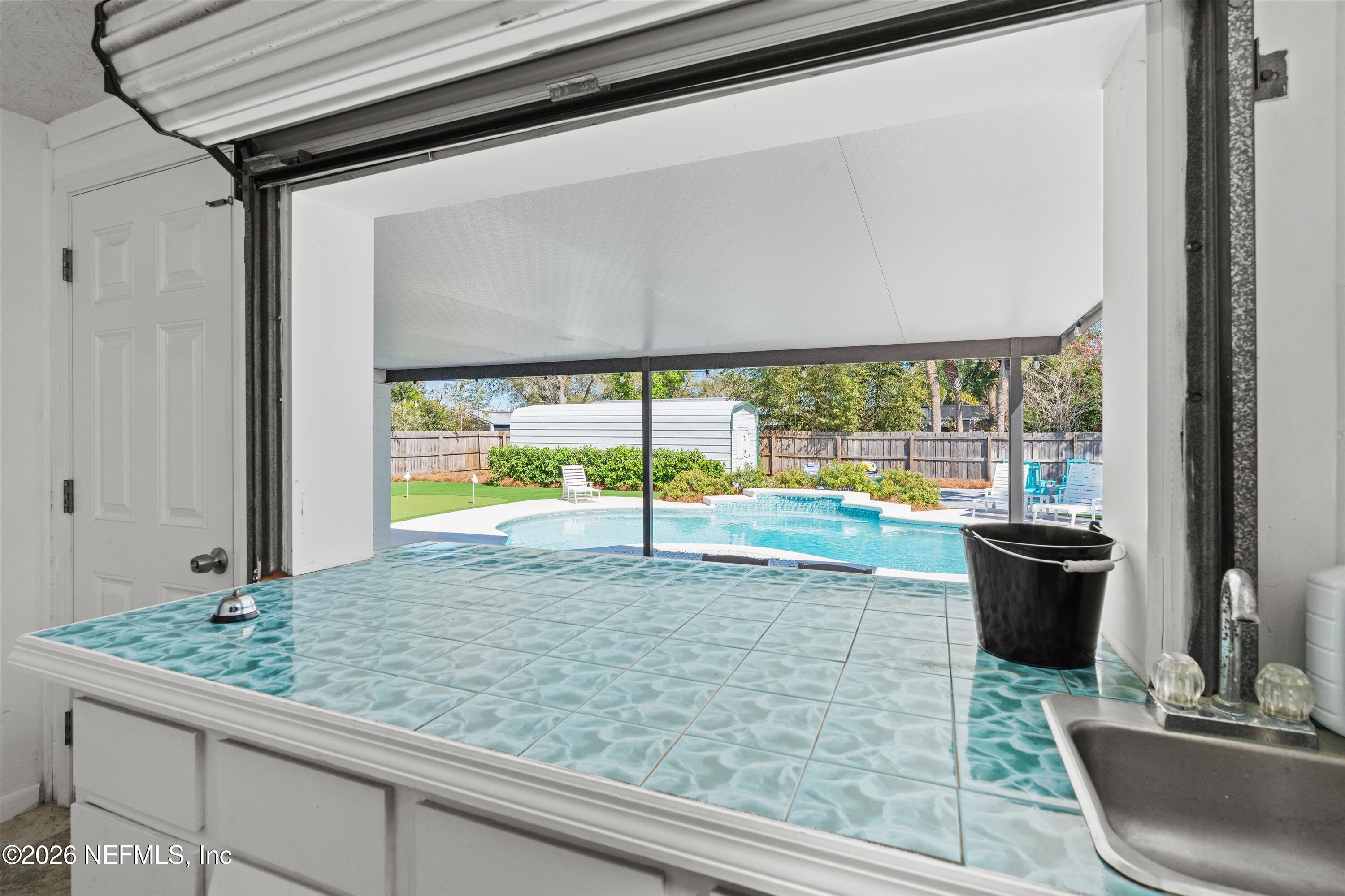 31 Norberta Way Jacksonville Beach, FL 32250 - Photo 14 of 49 a view of swimming pool from a window