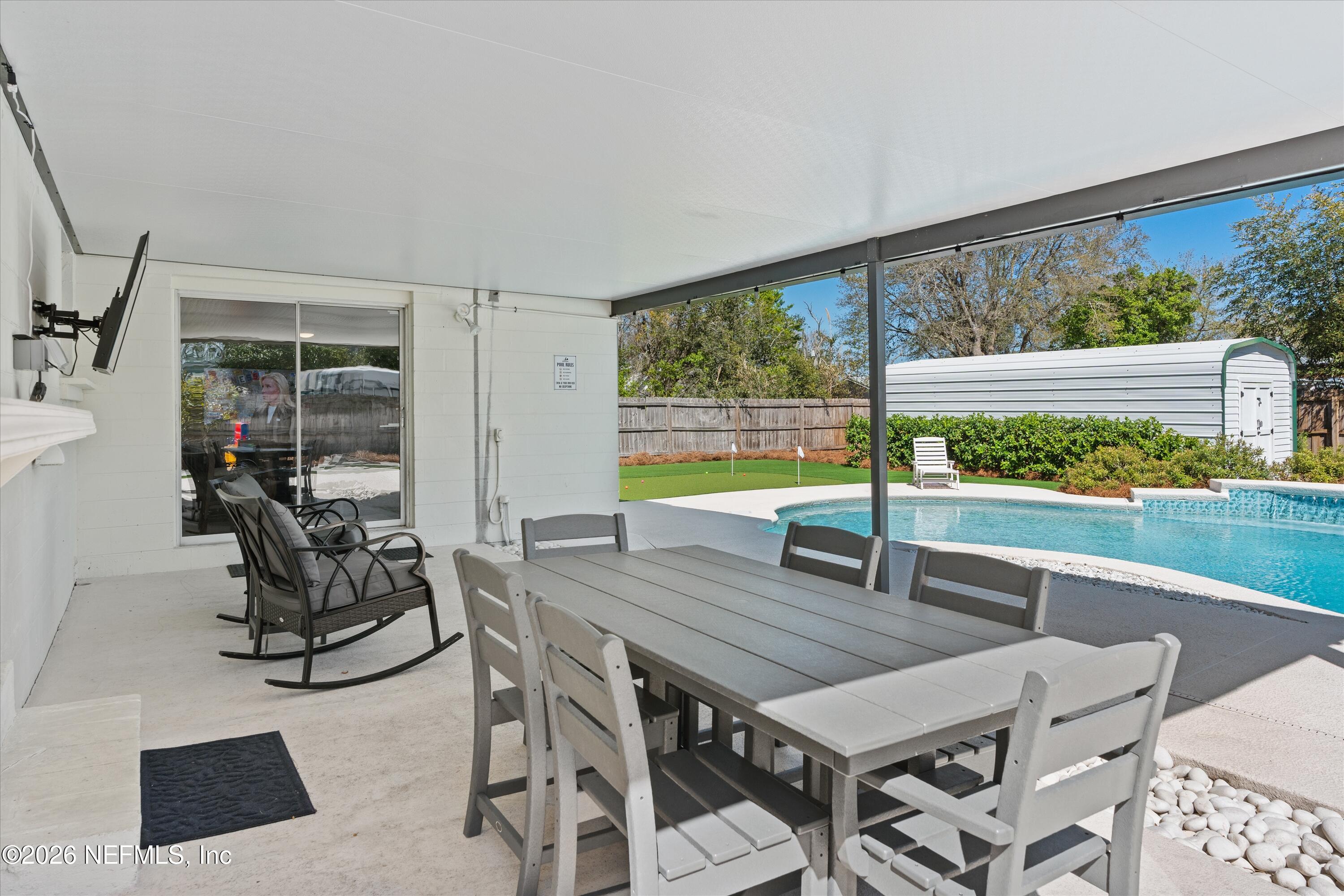 31 Norberta Way Jacksonville Beach, FL 32250 - Photo 15 of 49 a dining room with furniture and a floor to ceiling window