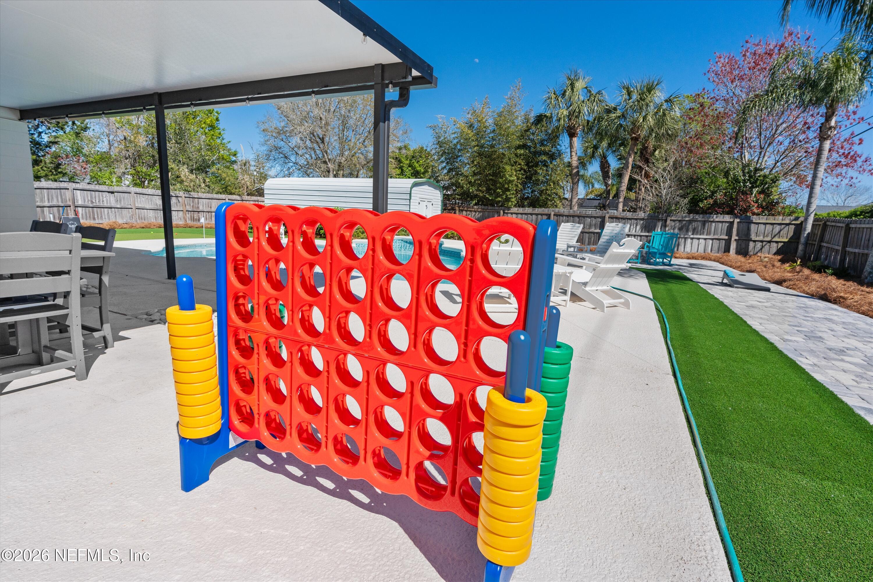 31 Norberta Way Jacksonville Beach, FL 32250 - Photo 18 of 49 a balcony with tall trees in front of it