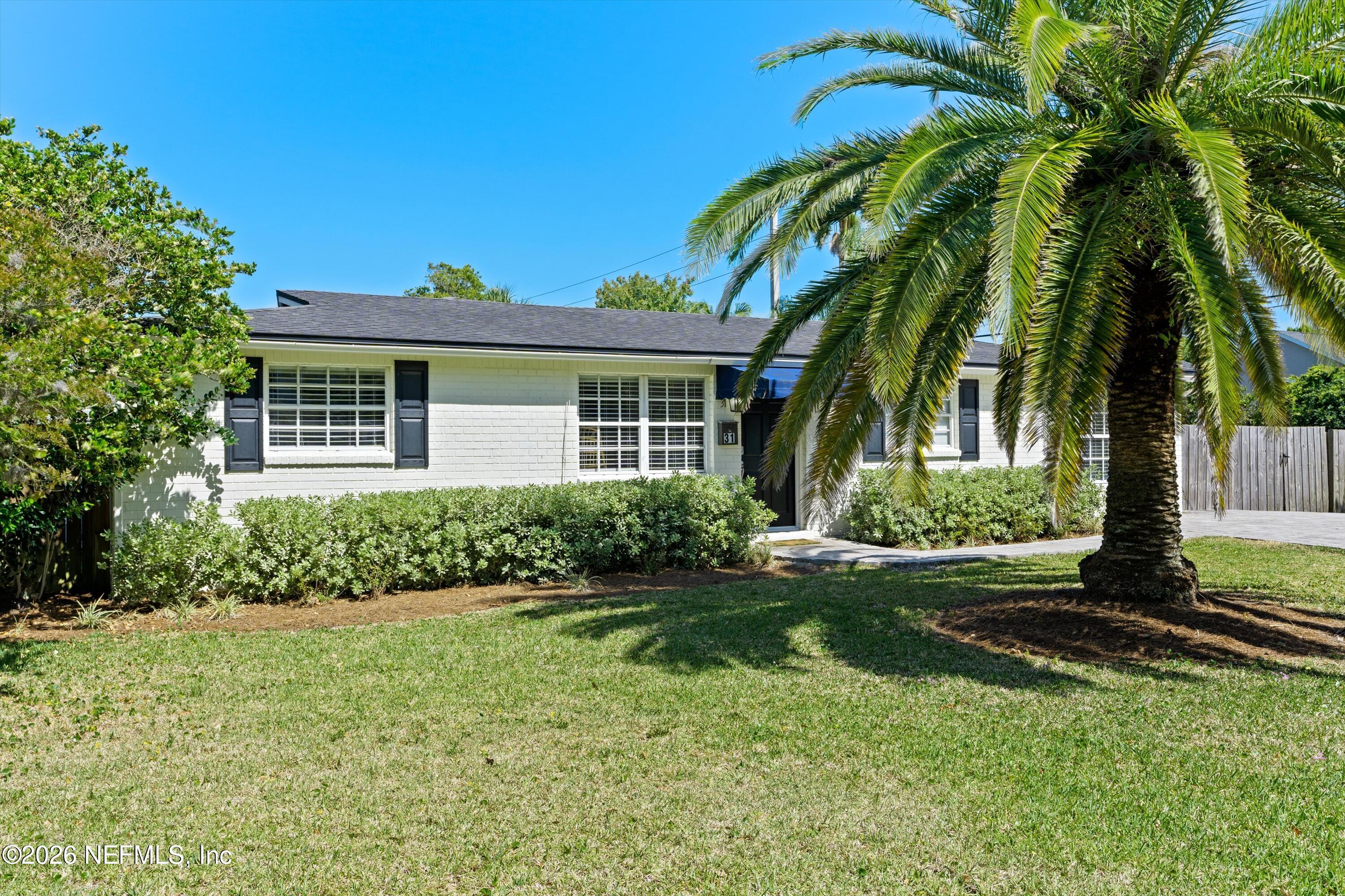 31 Norberta Way Jacksonville Beach, FL 32250 - Photo 24 of 49 a front view of a house with a garden
