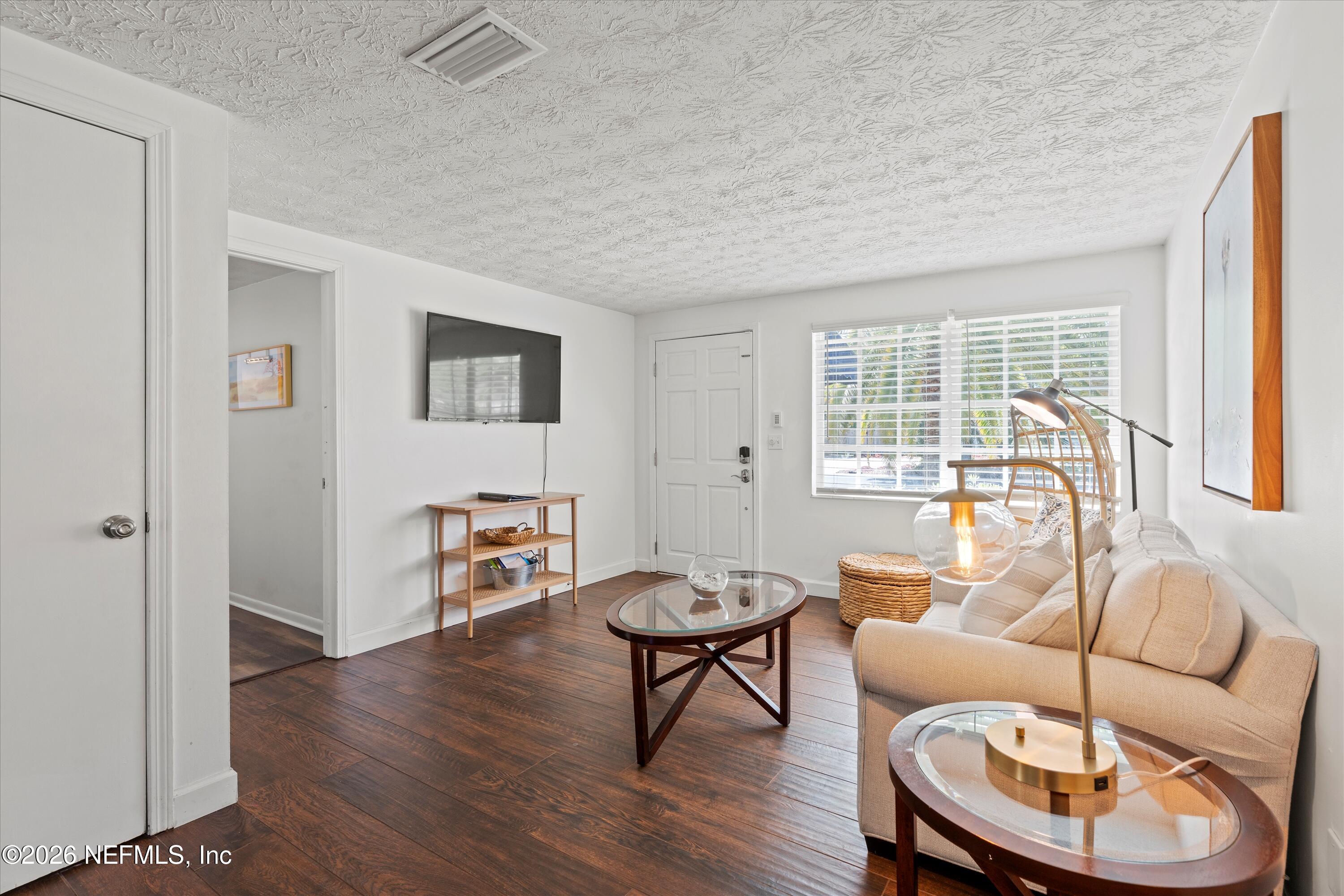 31 Norberta Way Jacksonville Beach, FL 32250 - Photo 26 of 49 a living room with furniture and a large window