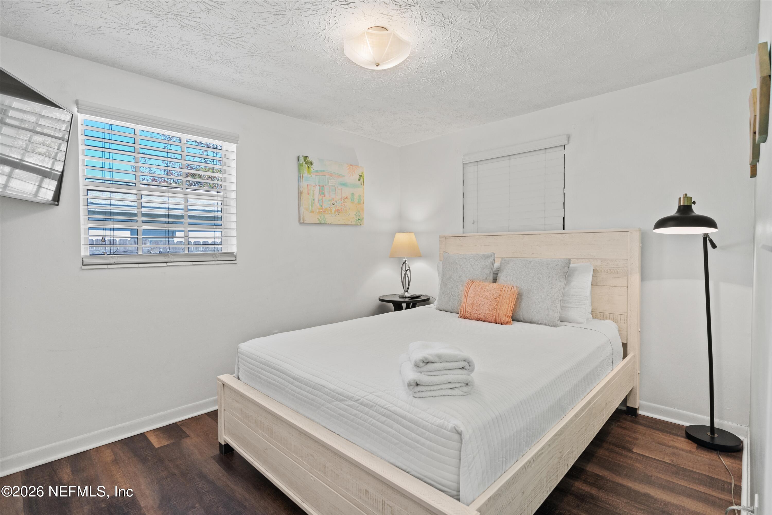 31 Norberta Way Jacksonville Beach, FL 32250 - Photo 40 of 49 a bedroom with a bed and wooden floor