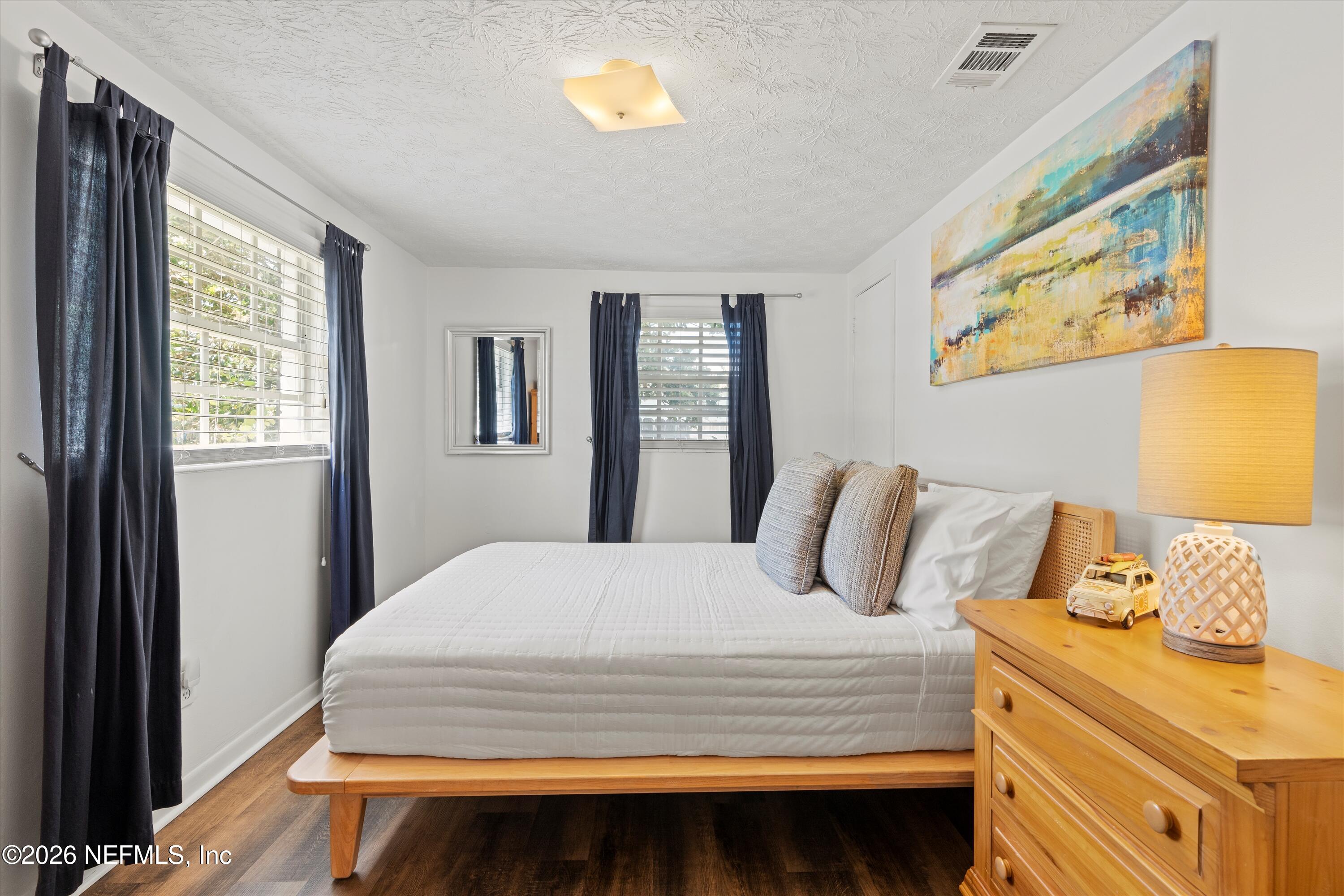 31 Norberta Way Jacksonville Beach, FL 32250 - Photo 41 of 49 a bedroom with a bed and wooden floor