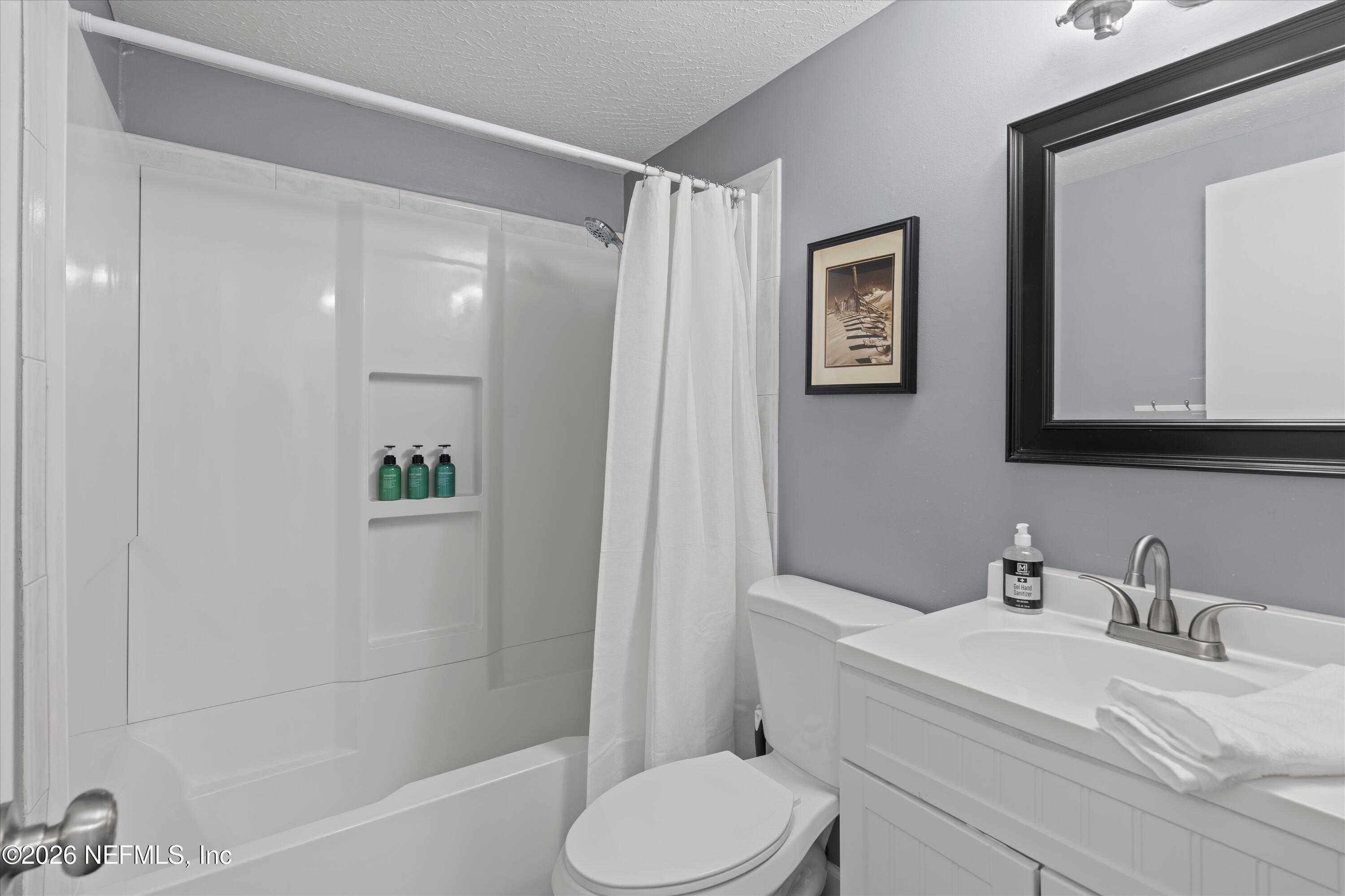 31 Norberta Way Jacksonville Beach, FL 32250 - Photo 42 of 49 a white toilet sitting next to a bathroom sink