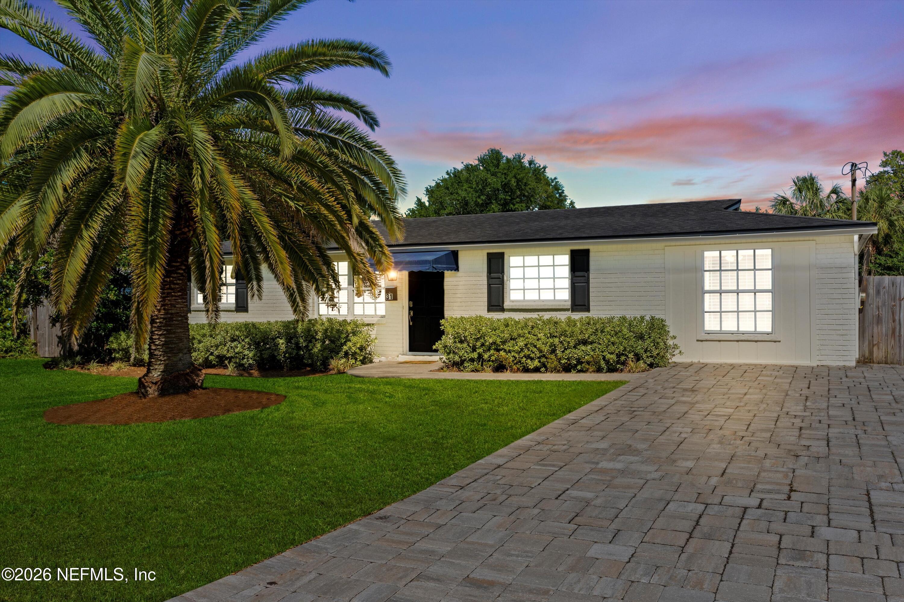 31 Norberta Way Jacksonville Beach, FL 32250 - Photo 46 of 49 a front view of a house with a garden