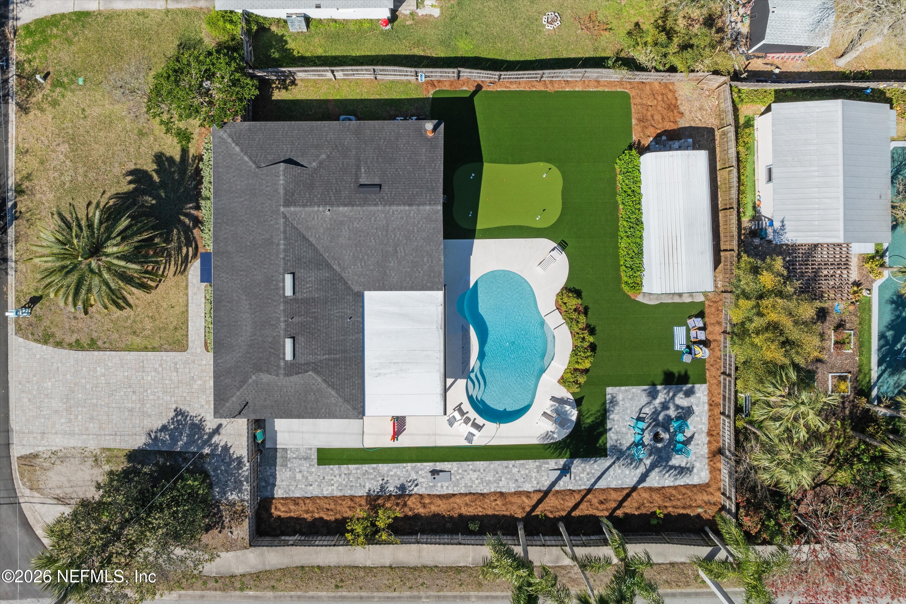 31 Norberta Way Jacksonville Beach, FL 32250 - Photo 47 of 49 an aerial view of a house with a garden and a swimming pool