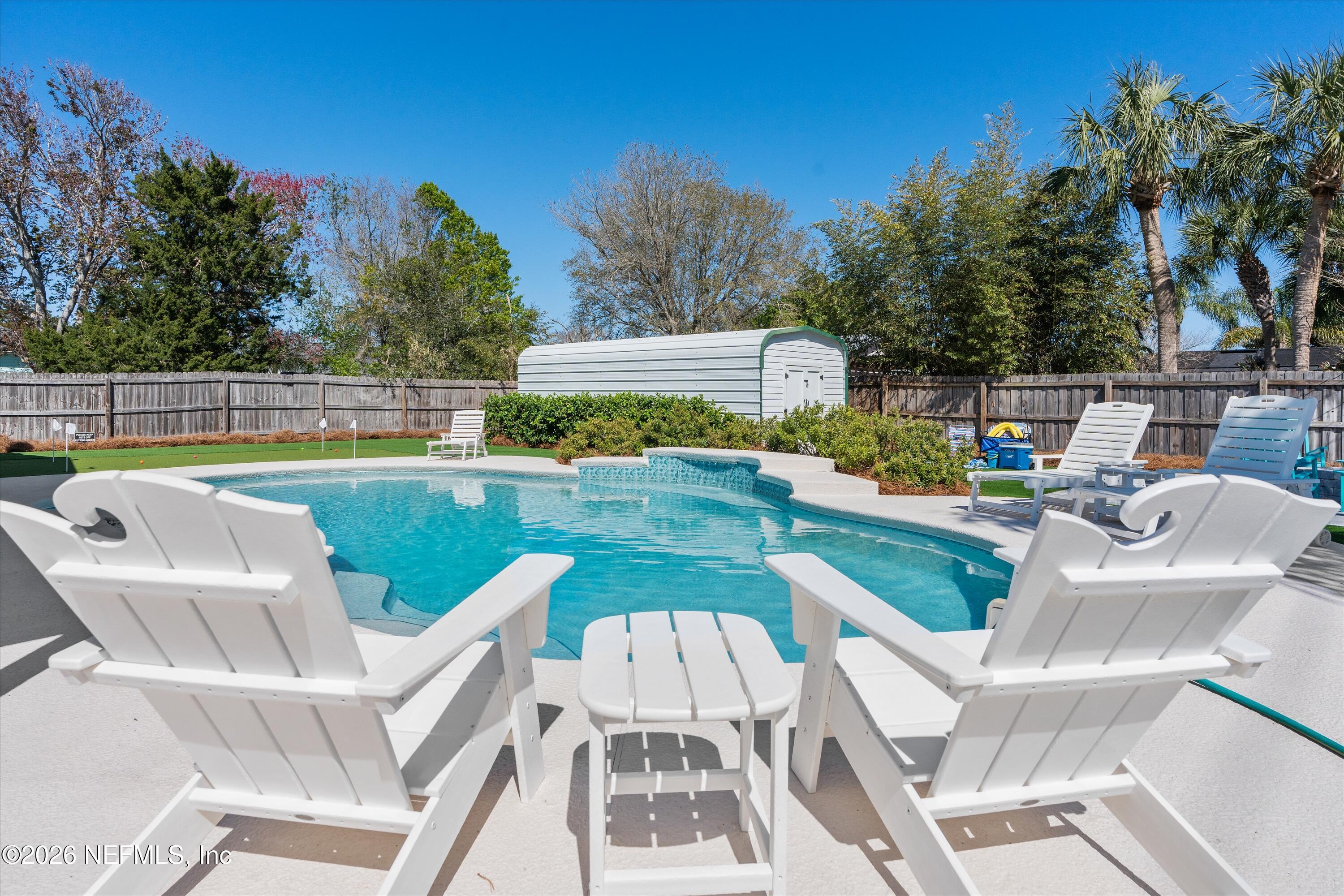 31 Norberta Way Jacksonville Beach, FL 32250 - Photo 6 of 49 a view of a swimming pool with a patio