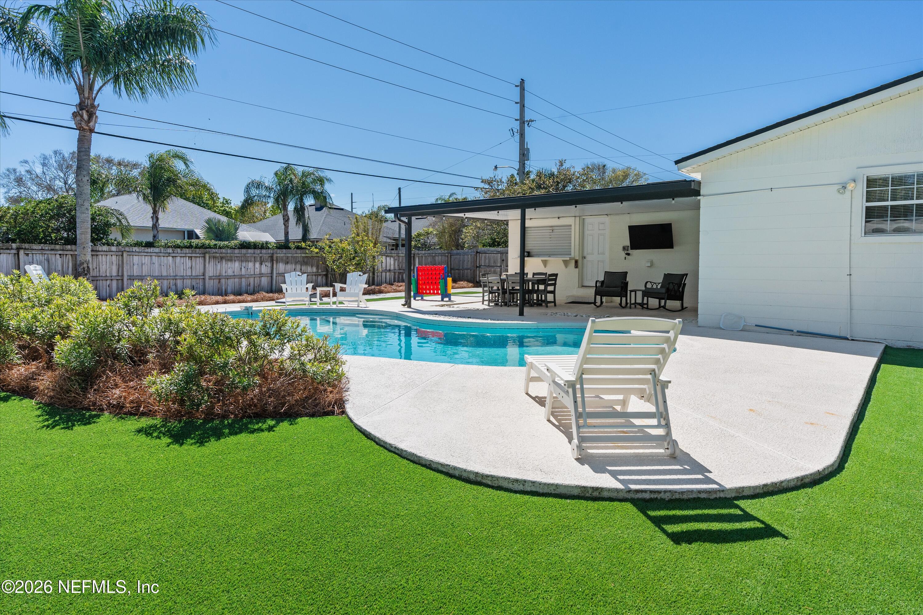 31 Norberta Way Jacksonville Beach, FL 32250 - Photo 7 of 49 a view of a swimming pool with a patio