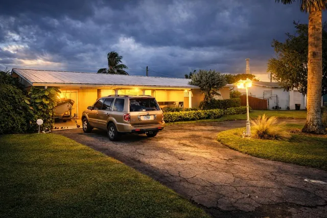 a view of a yard with car parked