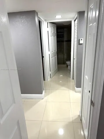 a kitchen with stainless steel appliances a refrigerator a stove a microwave and cabinets