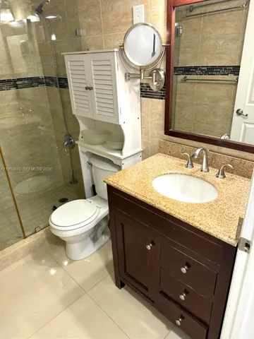 a view of a porch with wooden floor and furniture