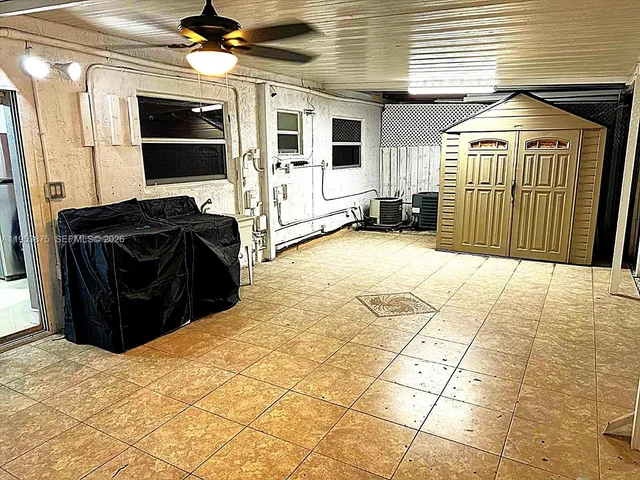 a view of a workspace with furniture