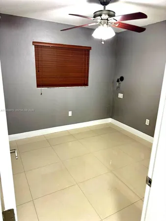 a bathroom with a window and a chandelier