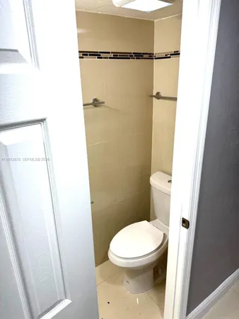 a bathroom with a shower and a sink