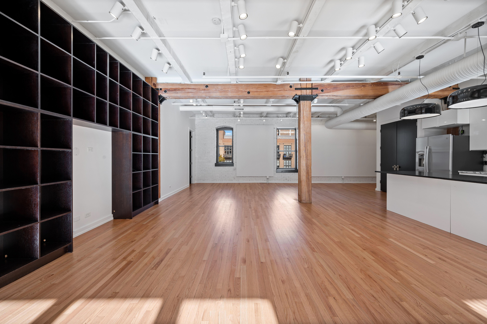 900 West Jackson Boulevard, Unit 3W Chicago, IL 60607 - Photo 19 of 38 a view of a room with wooden floor
