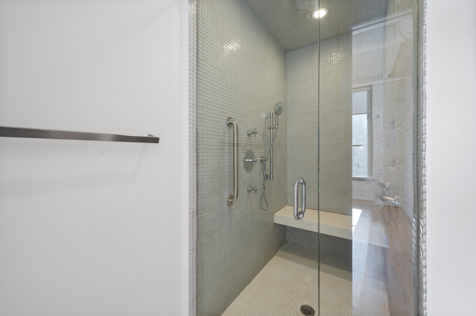 900 West Jackson Boulevard, Unit 3W Chicago, IL 60607 - Photo 27 of 38 a bathroom with a glass door shower