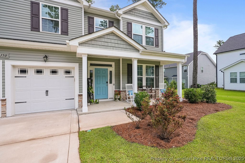 150 Timber Skip Drive Spring Lake, NC 28390 - Photo 3 of 39 a front view of a house with a yard