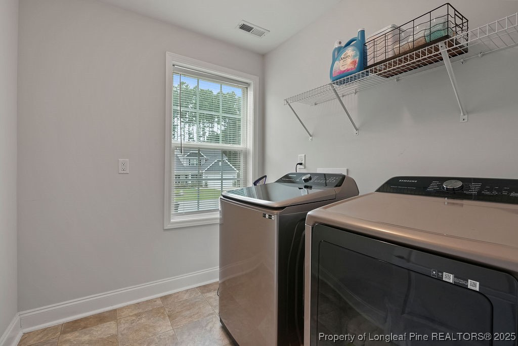 150 Timber Skip Drive Spring Lake, NC 28390 - Photo 32 of 39 a utility room with dryer and washer