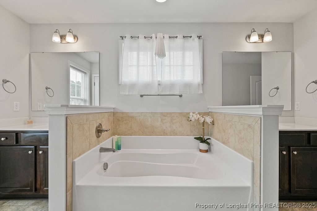 150 Timber Skip Drive Spring Lake, NC 28390 - Photo 35 of 39 a bathroom with a bathtub and a sink