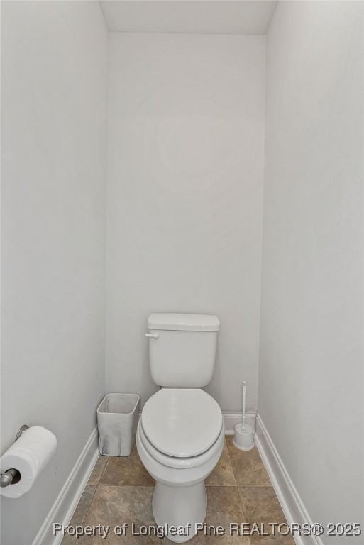 150 Timber Skip Drive Spring Lake, NC 28390 - Photo 36 of 39 a white toilet sitting next to a white wall