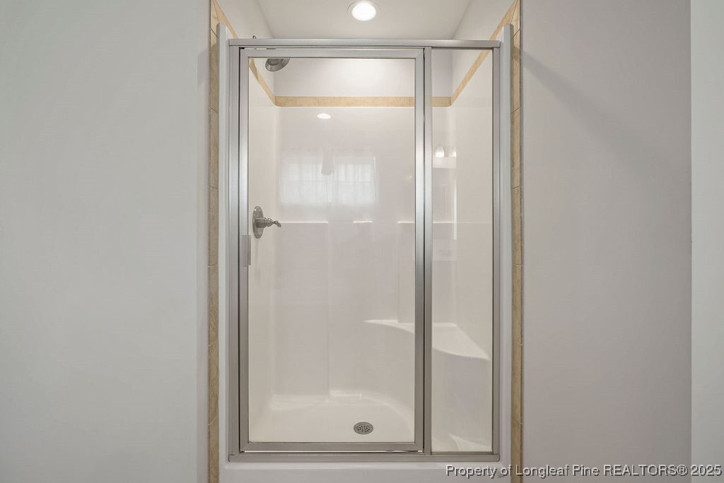 150 Timber Skip Drive Spring Lake, NC 28390 - Photo 37 of 39 a bathroom with a glass shower door