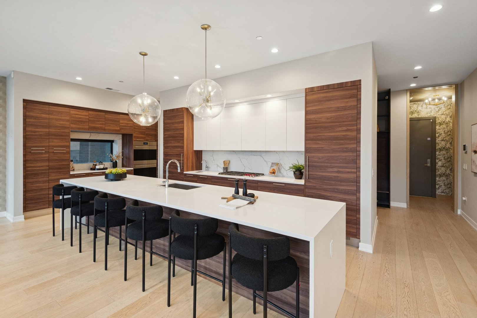 123 South Peoria Street, Unit P2 Chicago, IL 60607 - Photo 18 of 50 a kitchen with a table chairs sink and cabinets