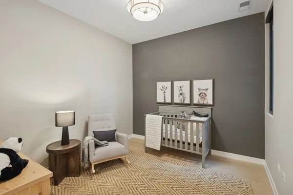 a bedroom with furniture and a window