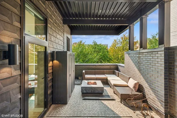 a view of a balcony with furniture