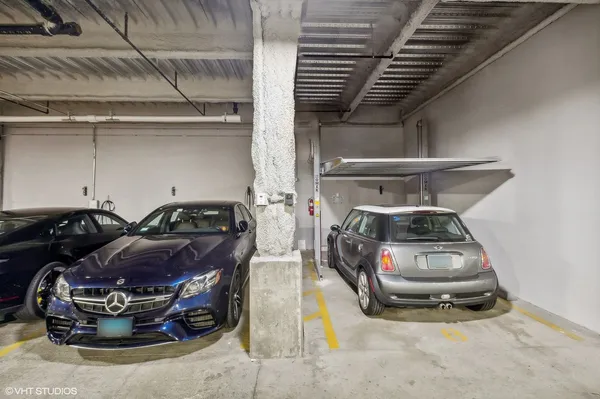 a view of a livingroom with a car parked in the main area