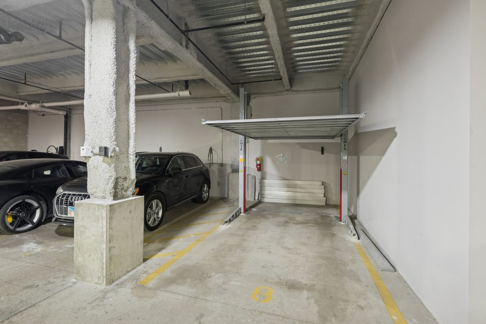 123 South Peoria Street, Unit P2 Chicago, IL 60607 - Photo 48 of 50 a view of a livingroom with a car parked in the main area