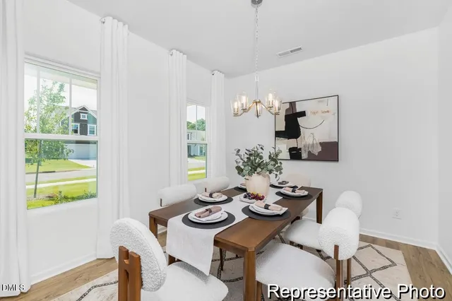 a view of a dining room with furniture window and outside view