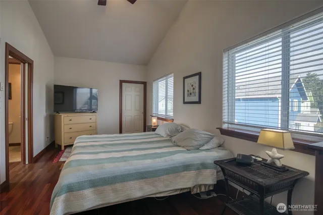 a bedroom with a bed and a television in it