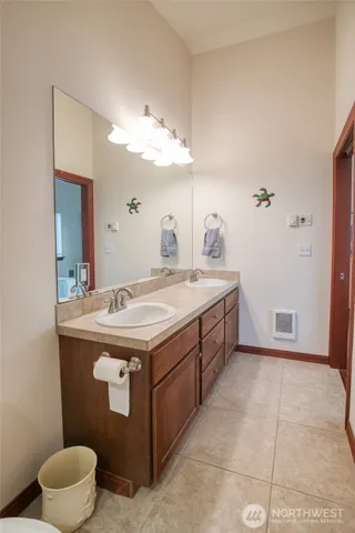 a room with a sink and a mirror