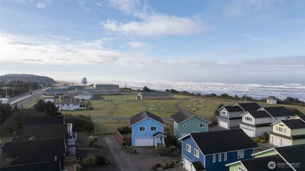 an aerial view of a house with a lake view