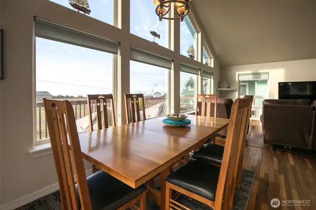 a view of a dining room with furniture window and wooden floor