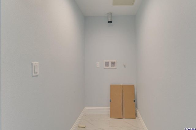 a bathroom with a toilet sink vanity and mirror