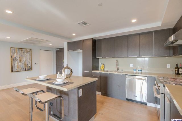 a kitchen with a stove and cabinets