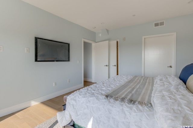 a bathroom with a shower a toilet and sink