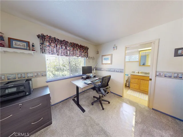 a workspace with furniture and a window