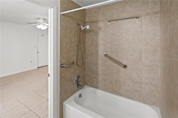 a bathroom with a bathtub and a shower