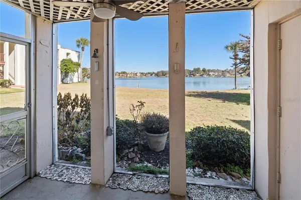 a view of a balcony with chair and glass door