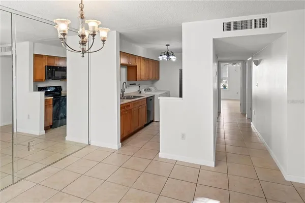 a view of a kitchen from the hallway