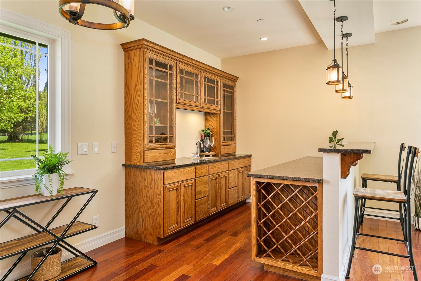 6082 Old Guide Road Bellingham, WA 98226 - Photo 13 of 39 a kitchen with stainless steel appliances granite countertop a stove a sink and a dining table with wooden cabinet