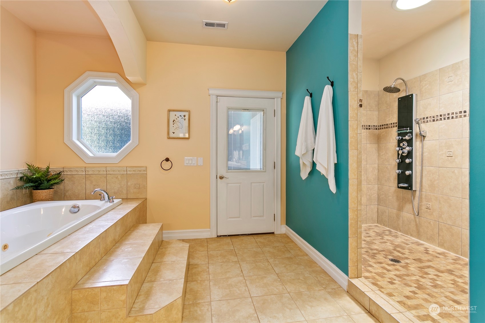 6082 Old Guide Road Bellingham, WA 98226 - Photo 26 of 39 a spacious bathroom with a tub sink and mirror