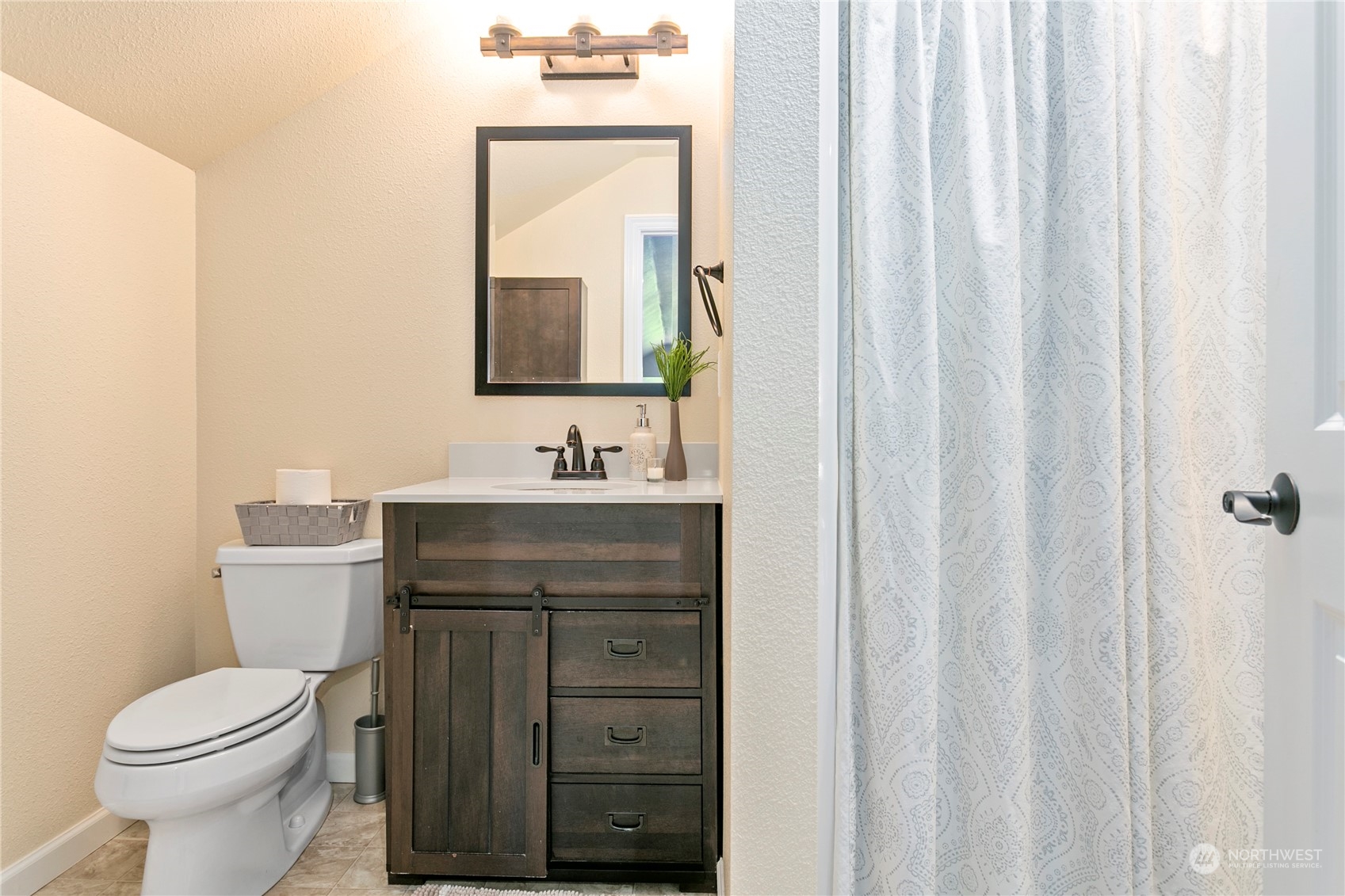 6082 Old Guide Road Bellingham, WA 98226 - Photo 31 of 39 a bathroom with a toilet a sink and a mirror