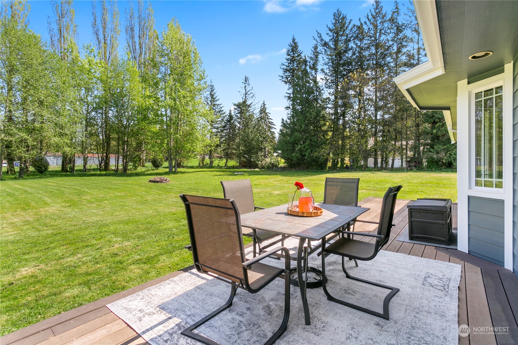 6082 Old Guide Road Bellingham, WA 98226 - Photo 37 of 39 a view of a chairs and table in patio with a yard