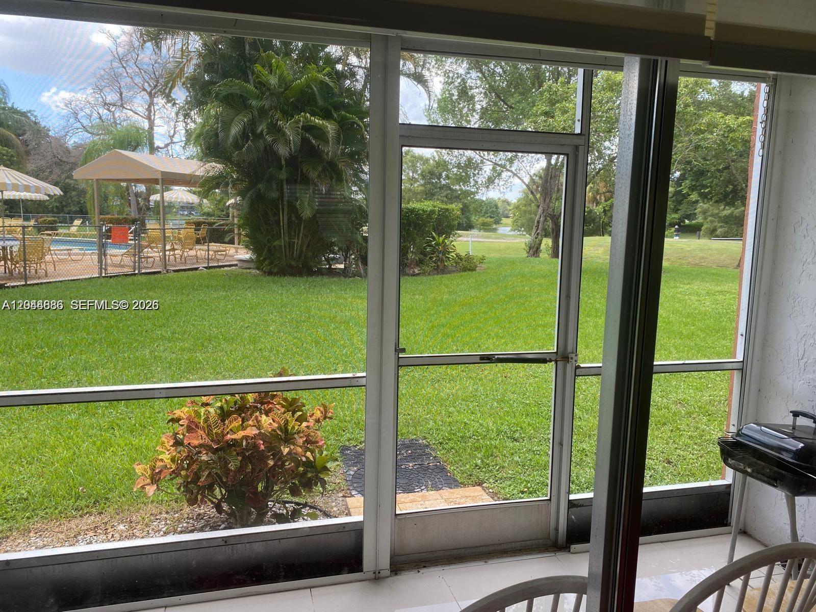 8838 West McNab Road, Unit 104 Tamarac, FL 33321 - Photo 18 of 23 a view of a back yard from a balcony